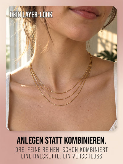 Sundrift in Gold, Nahaufnahme der drei feinen Kettenreihen am Hals